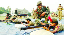 Girl NCC cadets practise firing at a shooting range in Amritsar on Saturday. 