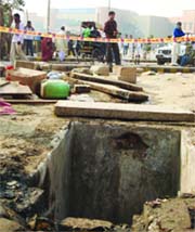 The sewer near the Anand Vihar railway station in New Delhi where three persons died