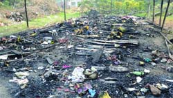 The charred remains of a night shelter near Rakabgunj Gurdwara in New Delhi that caught fire