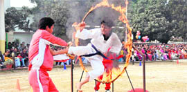 A student displays his martial art skills at the annual Sports Day function of the junior section of Doon International School in Dehradun on Saturday.