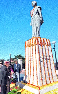 Chief Minister Prem Kumar Dhumal pays floral tributes to former Prime Minister Indira Gandhi at the Ridge in Shimla on Saturday