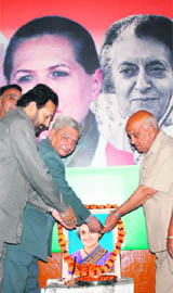 Congress leaders pay floral tributes to Indira Gandhi at the Pradesh Congress Committee headquarters in Jammu on Saturday. 