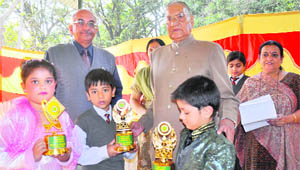 Capt Dewan Singh gives away prizes to the winners of the competition at Maharaja Hari Singh Agricultural Collegiate School in Jammu on Saturday. 