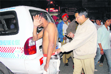 An alleged assailant in police custody.