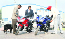Security officials check the bikes to be used by actors Akshay Kumar and John Abraham. 