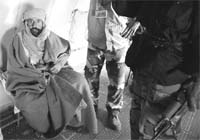 Saif al-Islam Gaddafi is pictured sitting in a plane in Zintan after he was captured in southern Libya