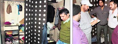 A relative of house owner Manjit Singh shows the ransacked wardrobes after the robbery incident in Palm Groove locality, Amritsar, and (right) police officials record statements of the family members