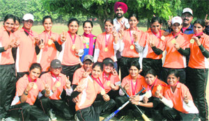 The winning team strike a pose with their medals in Chandigarh on Sunday. 