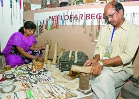 Mohd Shariq, bone artist, and his wife at the Delhi Pavilion during the trade fair at Pragati Maidan in New Delhi