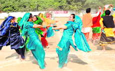 Students perform gidha and bhangra during the annual day of Doon International School in Dehradun on Sunday