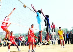 A match in the state-level Sub-junior Volleyball Tournament in progress at the Parade Ground in Dehradun on Sunday