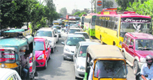 A long queue of vehicles on one of the busy roads following protest by women protesters in Jalandhar on Sunday. 