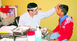 A doctor examines a patient during an ENT check-up camp in Jagraon on Sunday.