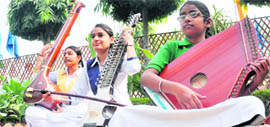 Students play tanti saaz musical instruments at Guru Nanak International School in Ludhiana.