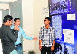 Visitors take pictures inside the museum against instructions in Jallianwala Bagh in Amritsar