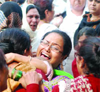 Eunuchs grieve over the death of fellows outside GTB Hospital in New Delhi on  Monday.