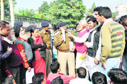 Uttarakhand Kranti Dal (P) workers submit a memorandum of demands to police officials in Dehradun