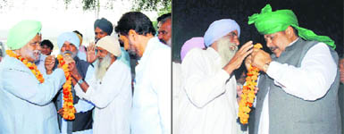 Former Union Home Minister Buta Singh receives garlands from villagers during his campaign for Congress candidate Jarnail Singh in Ratia on Monday; and (right) INLD leader Ajay Singh Chautala accepts greetings from a voter while canvassing from party nominee Sarfi Bai. 