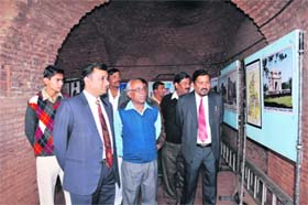 Rajender Singh Rana (extreme right), deputy director, Srikrishna Museum, Kurukshetra, at the photo exhibition in Kurukshetra