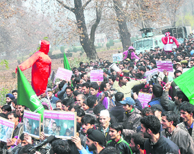 Peoples Democratic Party activists hold a rally against the state government in Srinagar on Monday.