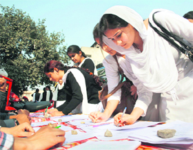 Students participate in a signature campaign against the governments recruitment policy in Jammu on Monday.