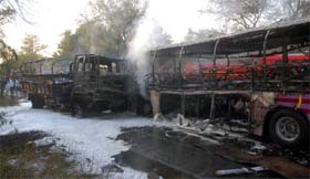 The bus, which was carrying the Indian women kabaddi team, and the Army truck (left) gutted after they collided head-on on the Barnala road