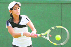 A girl plays a shot during the Shivalik Public School CLTA-AITA Championship Series at Sector 10 in Chandigarh on Tuesday. 
