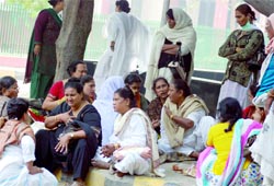 Members of the eunuch community wait for a body of a fellow outside the mortuary of GTB Hospital in New Delhi on Tuesday