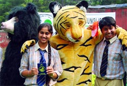 Schoolchildren protest against the destruction of forests for coal mining in New Delhi on Tuesday