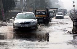 Sewer water floods the road near the Hero Honda Chowk in Sector 37, Gurgaon