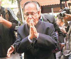 Finance Minister Pranab Mukherjee arrives for the winter session of Parliament. 