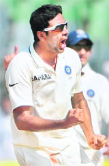 Indias off-spinner R Ashwin celebrates after taking a wicket in Mumbai on Tuesday. 