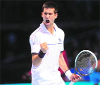 Novak Djokovic of Serbia reacts after winning a point against Tomas Berdych of the Czech Republic during their ATP World Tour Finals in London on Tuesday. 