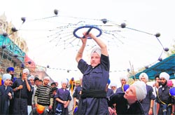 A foreigner Sikh teenager performs gatka in Amritsar on Wednesday