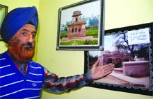 Baljit Singh displays his work at an exhibition in Amritsar on Wednesday