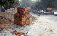 Construction material lying in front of the District Administrative Complex in Bathinda. 