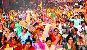 Activists of the Bhartiya Mazdoor Sangh shout slogans during a protest march to Parliament against corruption, rising prices, and for implementation of labour laws in New Delhi on Wednesday