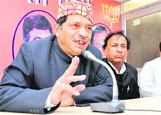 BS Rawat, senior BJP leader, addresses a press conference in Dehradun on Wednesday