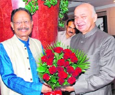 Chief Minister BC Khanduri with Union Minister for Power Sushil Kumar Shinde in Delhi on Wednesday. 