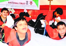 Samarth Special School children perform an asana at a programme organised in Haridwar