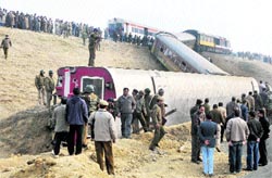 Railway officials at the accident site in Sadura, 55 km south of Srinagar, on Wednesday