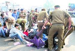 Members of the Jan Jagriti Manch involved in a scuffle with the police during a protest against the new recruitment policy of the government in Jammu on Wednesday