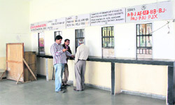 Residents wait in vain to collect documents from a counter of the district transport office which remained closed following a strike in Jalandhar