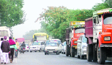 Vehicles stranded in a traffic jam following a rally organised to announce the merger of Balwant Singh Ramoowalias Lok Bhalai Party with the Shiromani Akali Dal on the Ferozepur road, near Ludhiana, on Wednesday. 