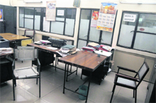 Empty chairs with slogan work is worship in the backdrop sum up the seriousness of the employees working at the mini secretariat in Ludhiana. 