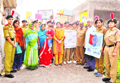 NCC cadets of Khalsa College for Women with residents of Sidhwan Kalan village during a rally against social evils near Jagraon on Wednesday.
