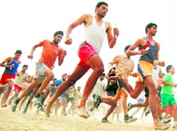 Aspirants participate in a race at an Army recruitment rally in Amritsar on Thursday