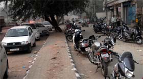 Vehicles parked on a service lane in Bathinda