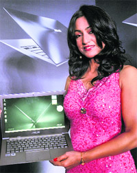 A model poses with the new ASUS Zenbook UX31 laptop computer in New Delhi on Thursday. The laptop, which comes in 11.6 and 13.3 screen versions, will retail for Rs 89,999 (about US $1,728) 