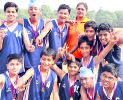 Team members of St Joseph Senior Secondary School in a jubilant mood after winning the Inter-School Basketball Tournament in Sector 46, Chandigarh, on Thursday